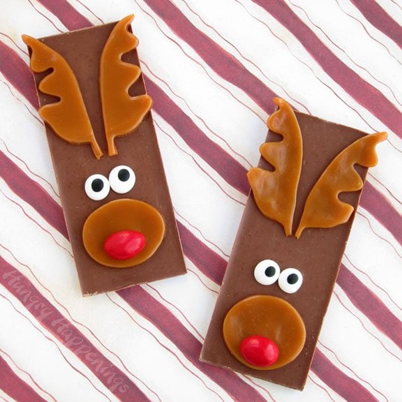 chocolate bars decorated like Rudolph the Red Nose Reindeer with caramel antlers, peanut M&M noses, and candy eyes. 