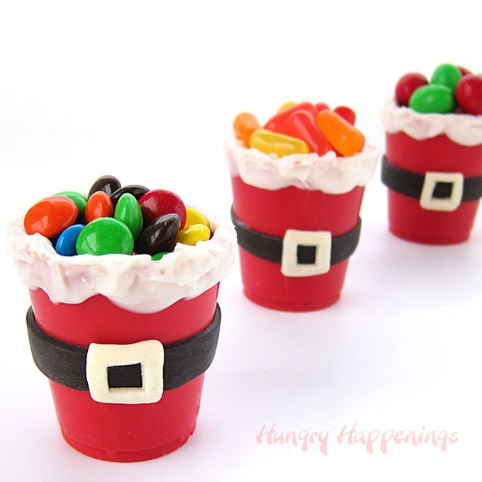 white chocolate Santa Suit Candy Cups filled with candy. 