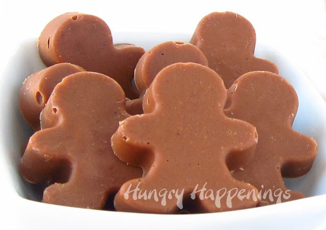 8 gingerbread men candies in a small white bowl.