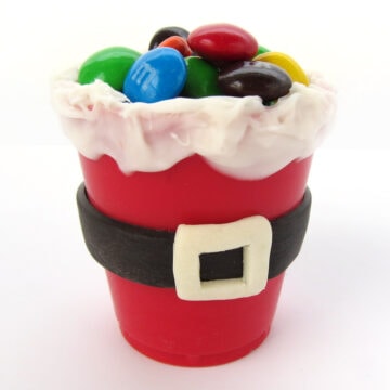 Santa suit candy cups filled with M&M's.