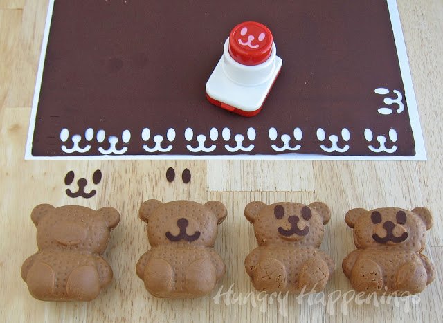 stamping cute bear faces out of frosting sheets and adding them to chocolate fudge bears. 