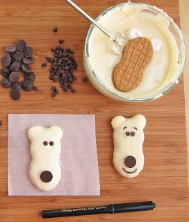 Transform a plain store bought cookie into a festive little treat! Make these Nutter Butter Polar Bear Cookies and your guests will be growling for you to whip up another batch!