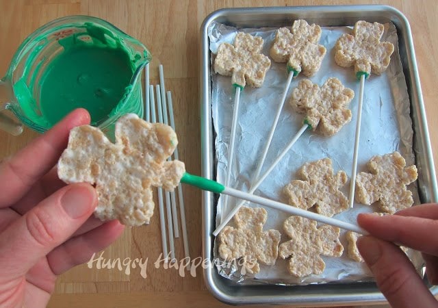 If you want to make a cute treat with your kids this St. Patrick's Day try out these Silly Shamrock Shaped Rice Krispies Treat Pops! Your kids can even make their own silly faces on these treats!