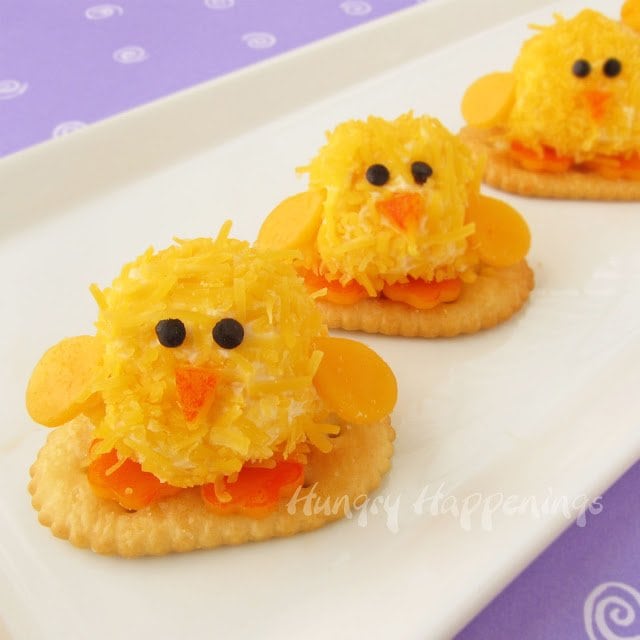 Get festive this Easter and make these adorable Easter Appetizers - Baby Chick Cheese Balls! These bite sized balls of fun are so cute and the perfect size to pop right in your mouth!
