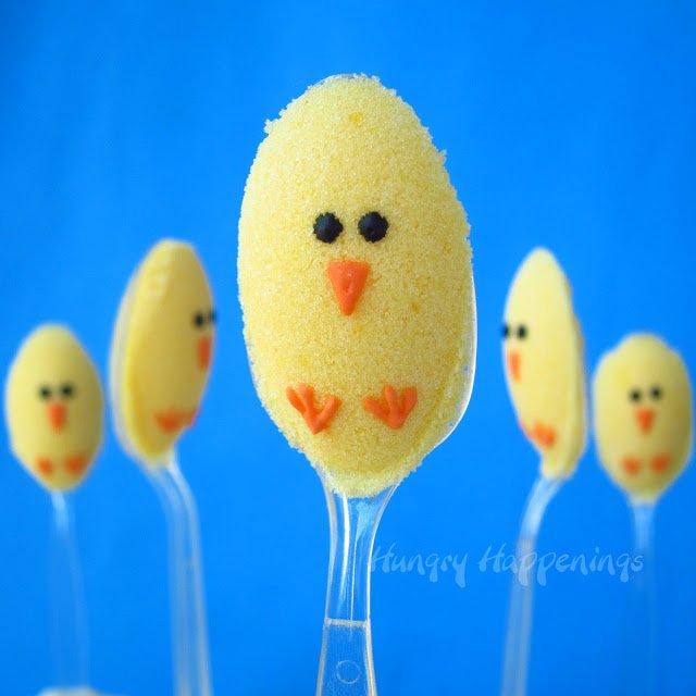 cute baby chick sugar spoons with orange beaks and feet and black eyes. 