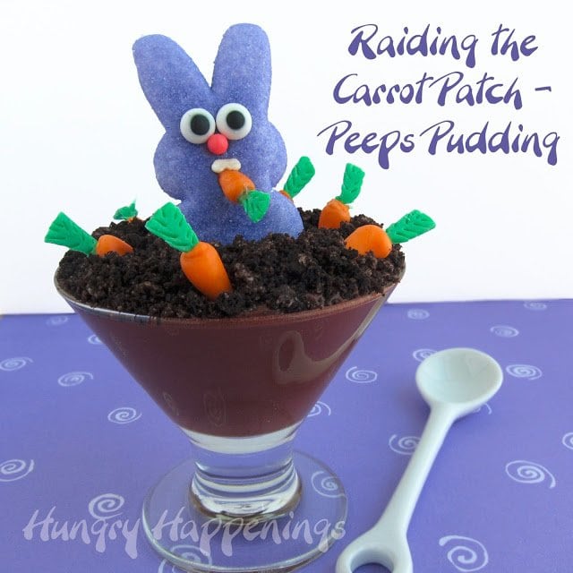 chocolate pudding dirt cup topped with candy carrots and a Peeps marshmallow bunny eating the carrots. 