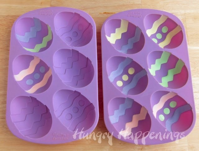 silicone Easter egg mold painted with colorful cheesecake filling. 