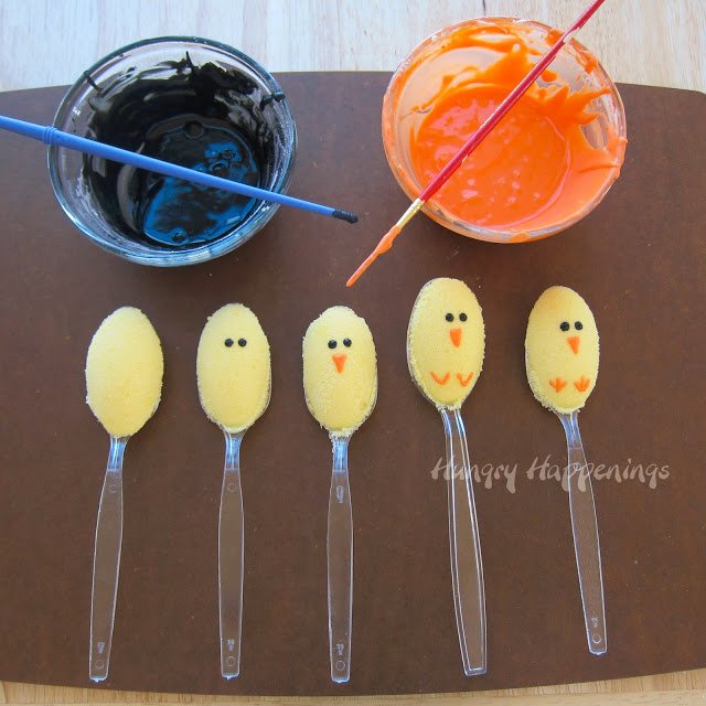 decorating sugar spoon chicks using orange and black candy melts. 