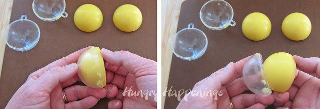 removing the yellow half-spheres from the plastic ornament molds. 