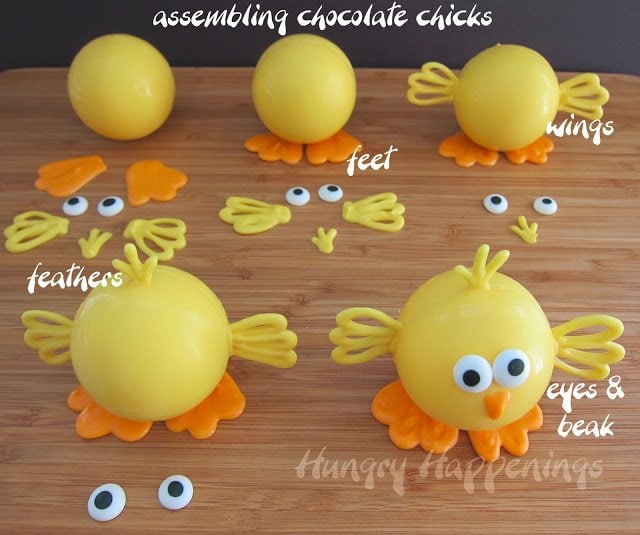 assembling white chocolate chicks with orange feet, yellow wings, orange beaks, yellow feathers, and two candy eyes. 