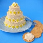 wedding cake cheese ball appetizer with daisy-shaped cheese
