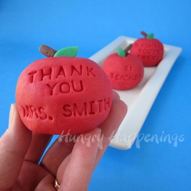 back to school fudge apples with personalized messages including, "Thank You Mrs. Smith," "#1 Teacher," and more.