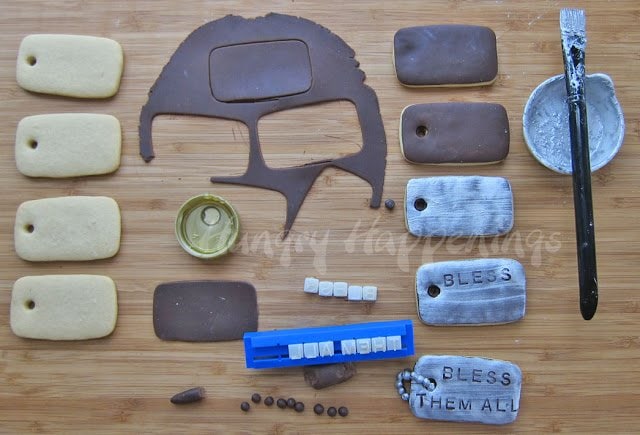 adding dark modeling chocolate over the dog-tag cookies, brushing with sliver luster dust, and personalizing with letter stamps. 