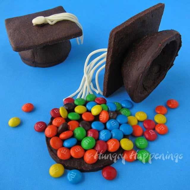 Chocolate grad cap cookies filled with mini M&M's.