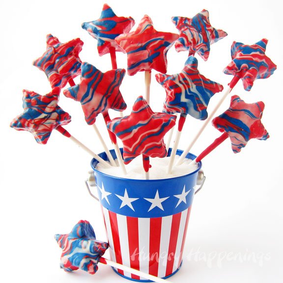Rice Krispie Treat Star Pops swirled with red, white, and blue candy melts. 