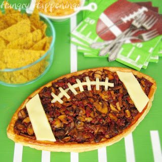 football tart topped with mushrooms and cheese. 