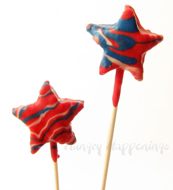 White chocolate dipped rice crispy treat stars swirled with red white and blue.