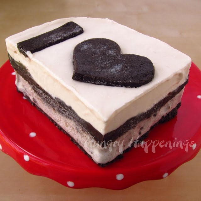 1 slice of cookies and cream ice cream cake topped with a heart. 
