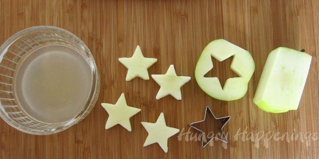 soak apple slices in lemon juice and cut out stars