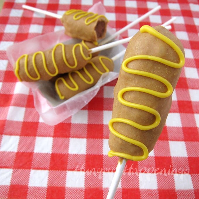 Decorate a cake pop to look like a fun carnival treat. These Cake Pop Corn Dogs look like a meal but taste like dessert. 