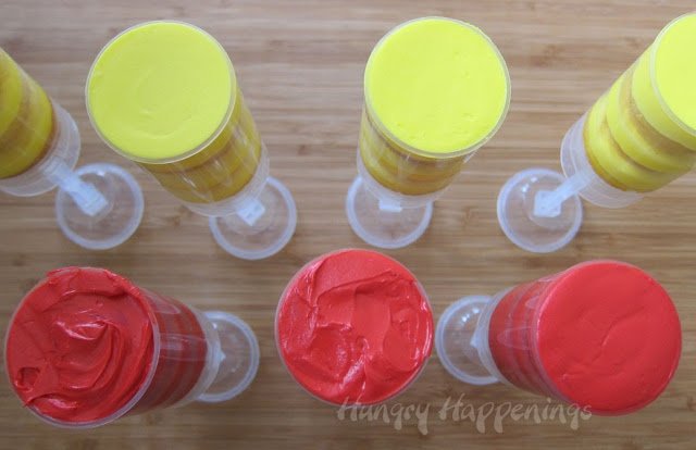 tops of the push-up pop containers showing the red and yellow frosting.