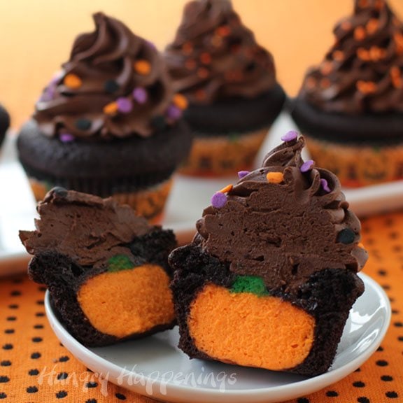 You absolutely have to make these fan favorite Ultimate Cheesecake Stuffed Halloween Cupcakes for your spooky party! These delicious treats will have everyone wondering how you got such an adorable surprise inside!