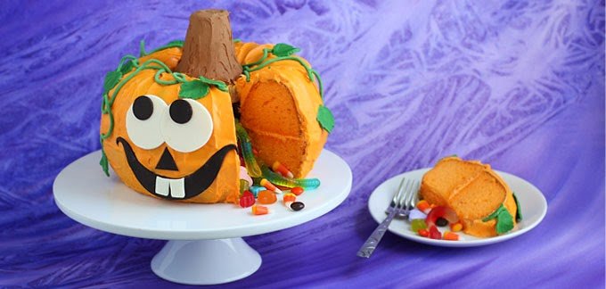Cut into this festive Pumpkin Pinata Cake to reveal candy hiding inside. This Halloween dessert will really wow your Halloween party guests.