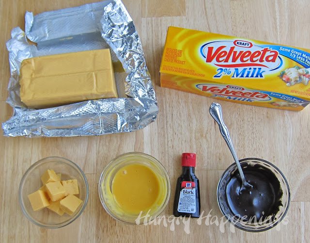 coloring melted Velveeta Cheese with black food coloring. 