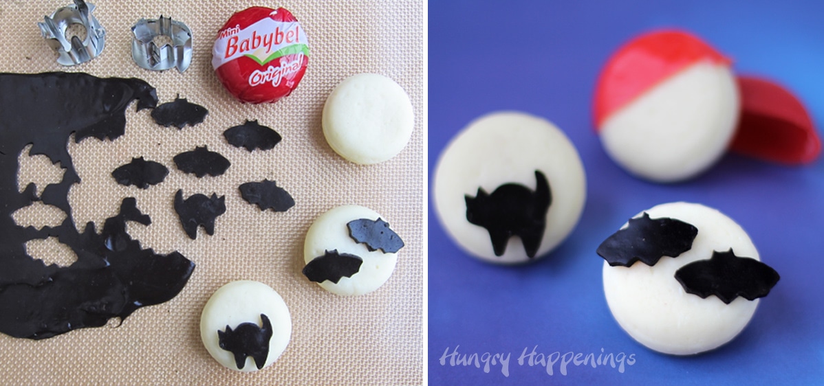 Babybel cheese topped with black Velveeta cheese bats and cat. 
