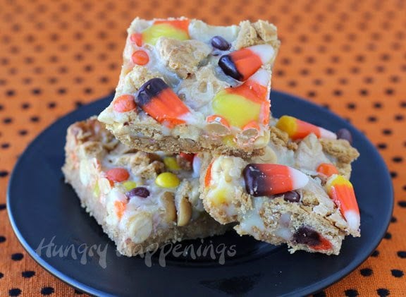 layered magic bars topped with candy corn, peanuts, and Reese's Pieces.