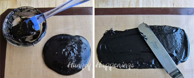 spreading black-colored Velveeta cheese onto a silicone mat. 