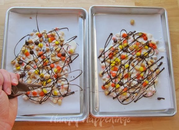 drizzling chocolate over the candy corn bark.