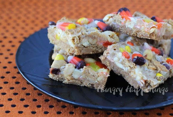 These Halloween Sweet and Salty Candy Corn Magic Bars are great for a last minute dessert! This simple dessert is a must have at any party, you won't be able to get enough!