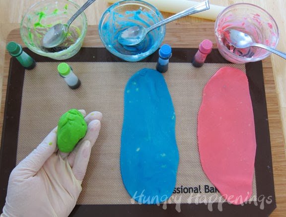 coloring white melted cheese using green, blue, and pink food coloring