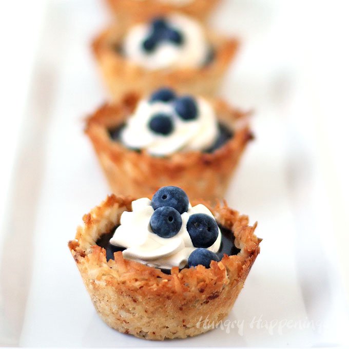 Make homemade coconut macaroon cups then fill them with freshly made blueberry curd for a lovely summer dessert. 