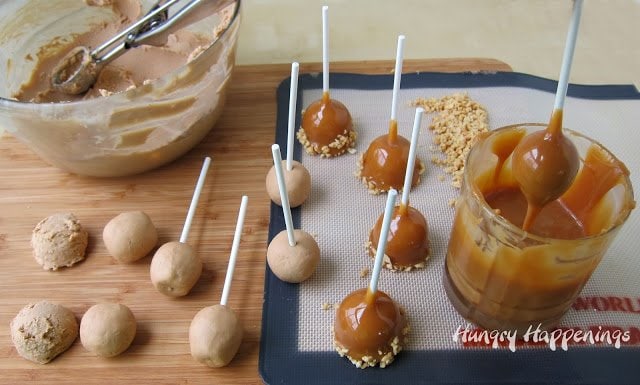 dipping fudge balls into melted caramel then rolling them in chopped peanuts. 