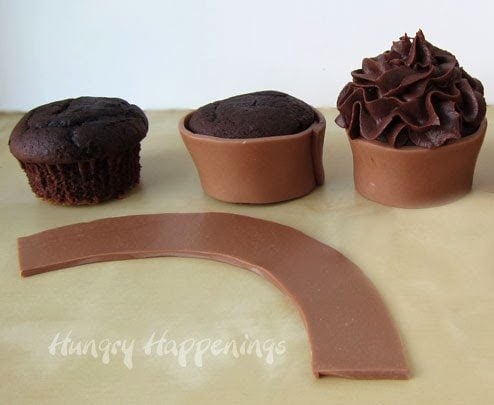 cutting out a dark brown belt from dark modeling chocolate and a gold buckle from luster dust-colored white chocolate. 