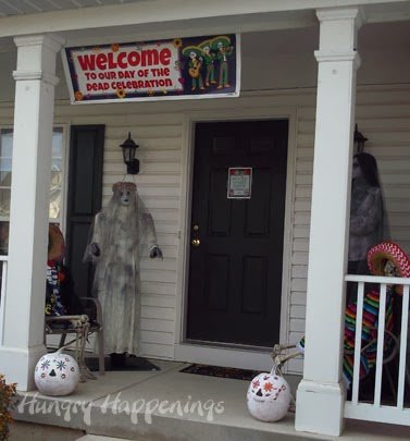 Day of the Dead decorations and welcome sign on front porch. 