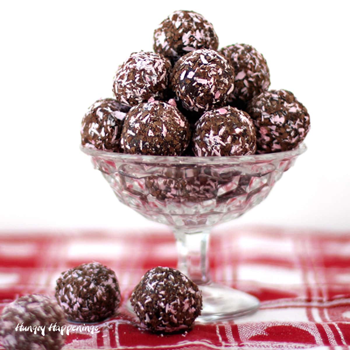 chocolate raspberry truffles made using chocolate and ice cream are coated in shaved pink candy melts and dark chocolate
