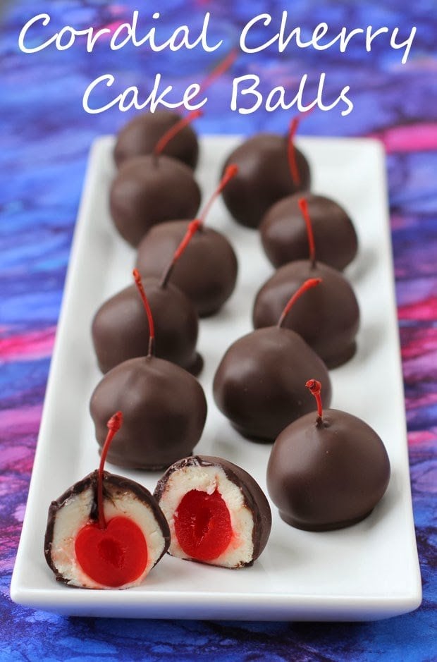 Cordial Cherry Cake balls with white cake wrapped around maraschino cherries are dipped in chocolate.