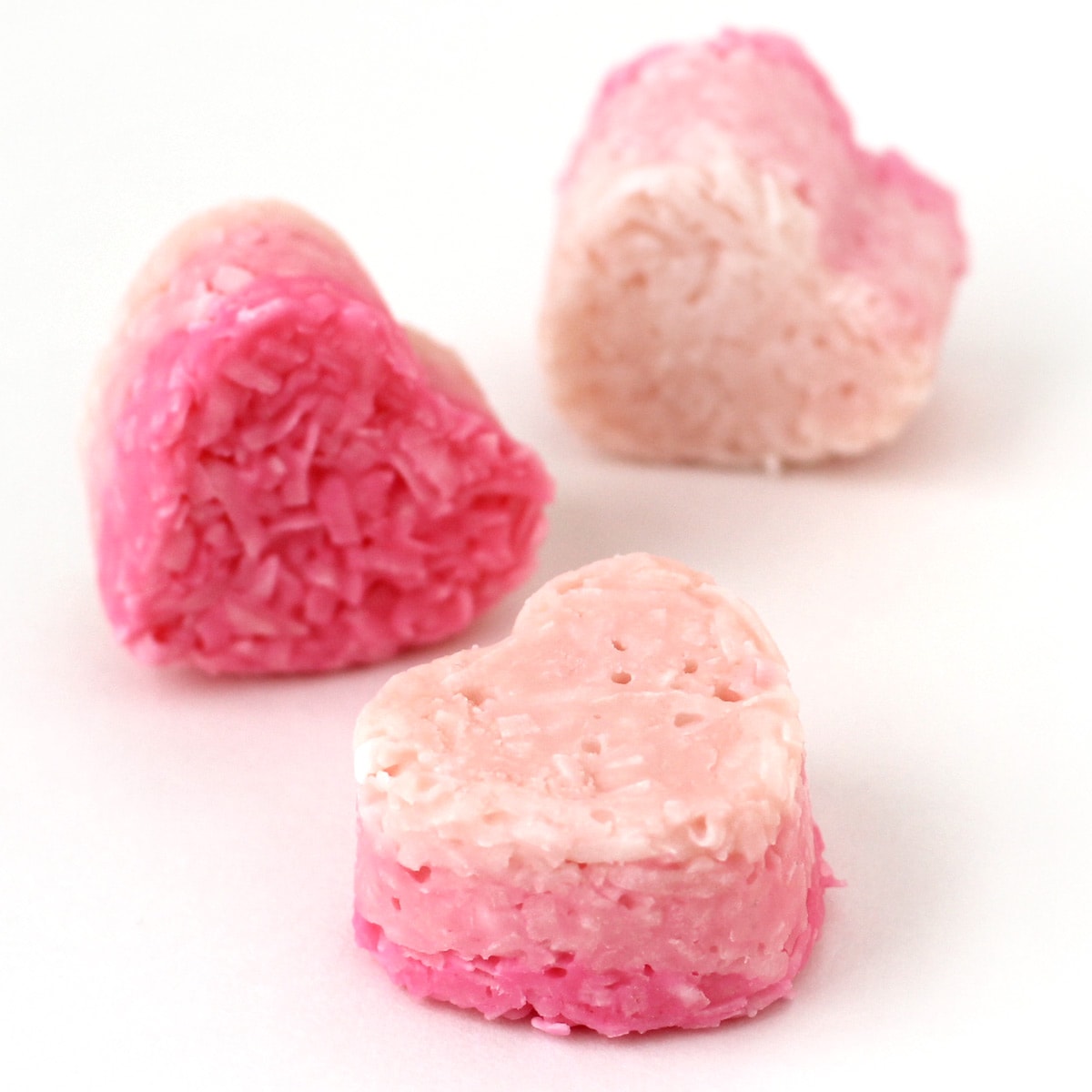 coconut candy hearts colored bright pink, medium pink, and light pink