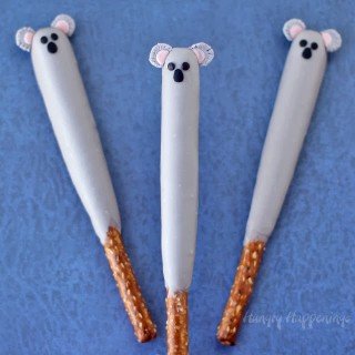 koala pretzel pops - white chocolate-dipped pretzel rods decorated with modeling chocolate