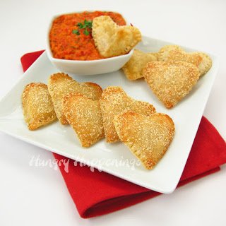 heart-shaped pastries filled with mozzarella cheese and served with roasted red pepper dip