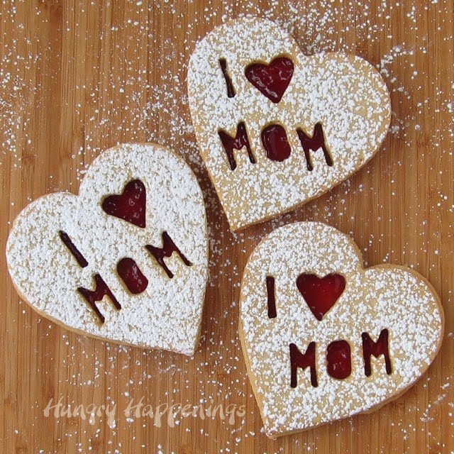 These Raspberry Linzer Cookie Hearts for Mom are the perfect treat to show your mom you care about her on Mother's Day. This sweet dessert will have your mouths watering and unable to get enough!