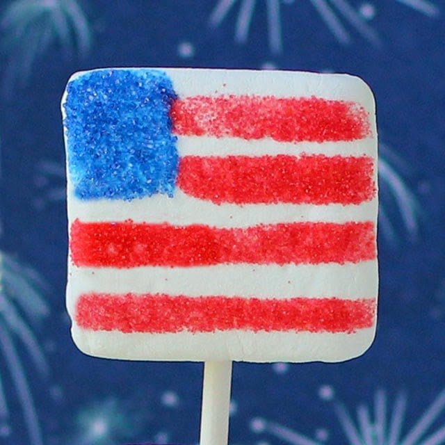 a square marshmallow decorated to look like a red, white, and blue American flag.