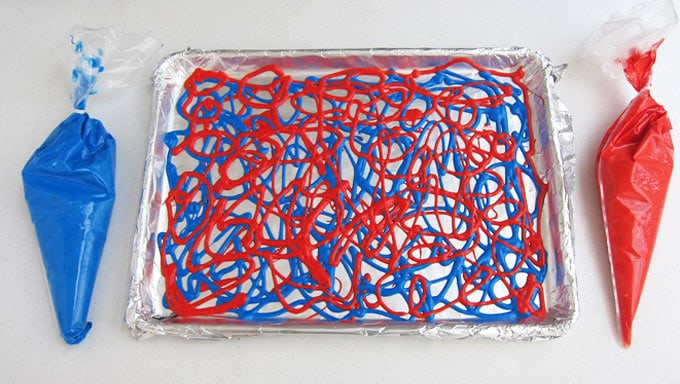 drizzle red and blue cake batter into a baking pan