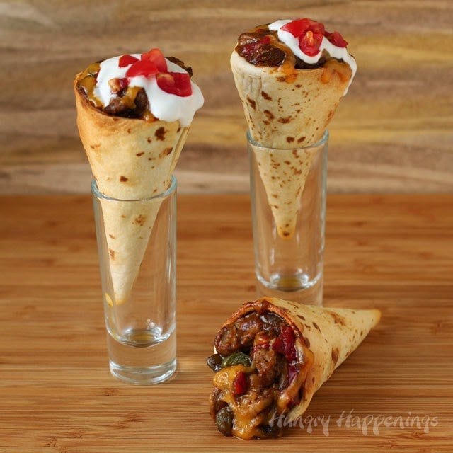 Tortilla Cones filled with steak, peppers, cheese, sour cream, and tomatoes. 