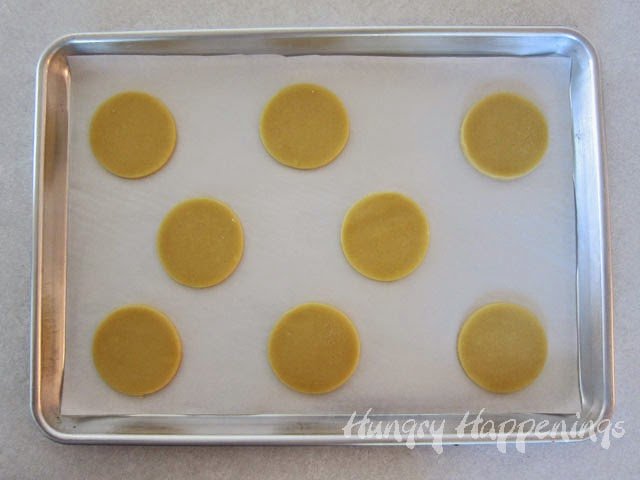 round cookies on a parchment paper-lined baking sheet. 