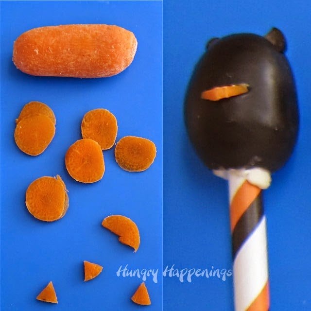 cut carrot slices into small triangular shaped beaks and insert one into an olive owl.