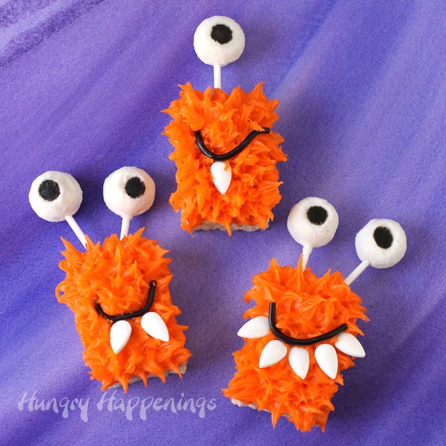 bright orange Rice Krispie Treat Monsters with big gummy eyes. 
